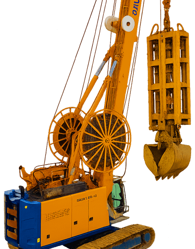 Machine de fondations spéciales en action – pelle à benne preneuse suspendue sur grue hydraulique